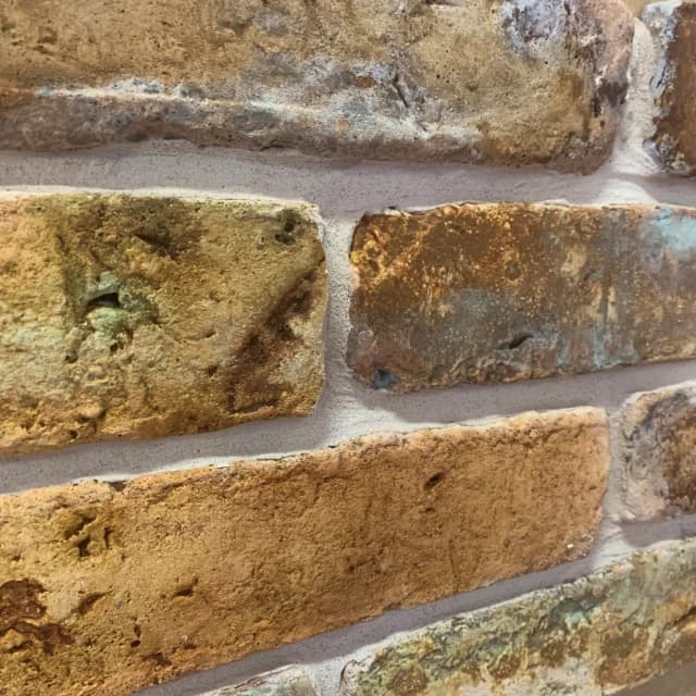 Old rusty golden brick